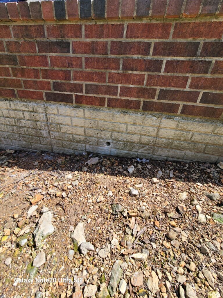 Drilled weep holes in the retaining walls for a client.