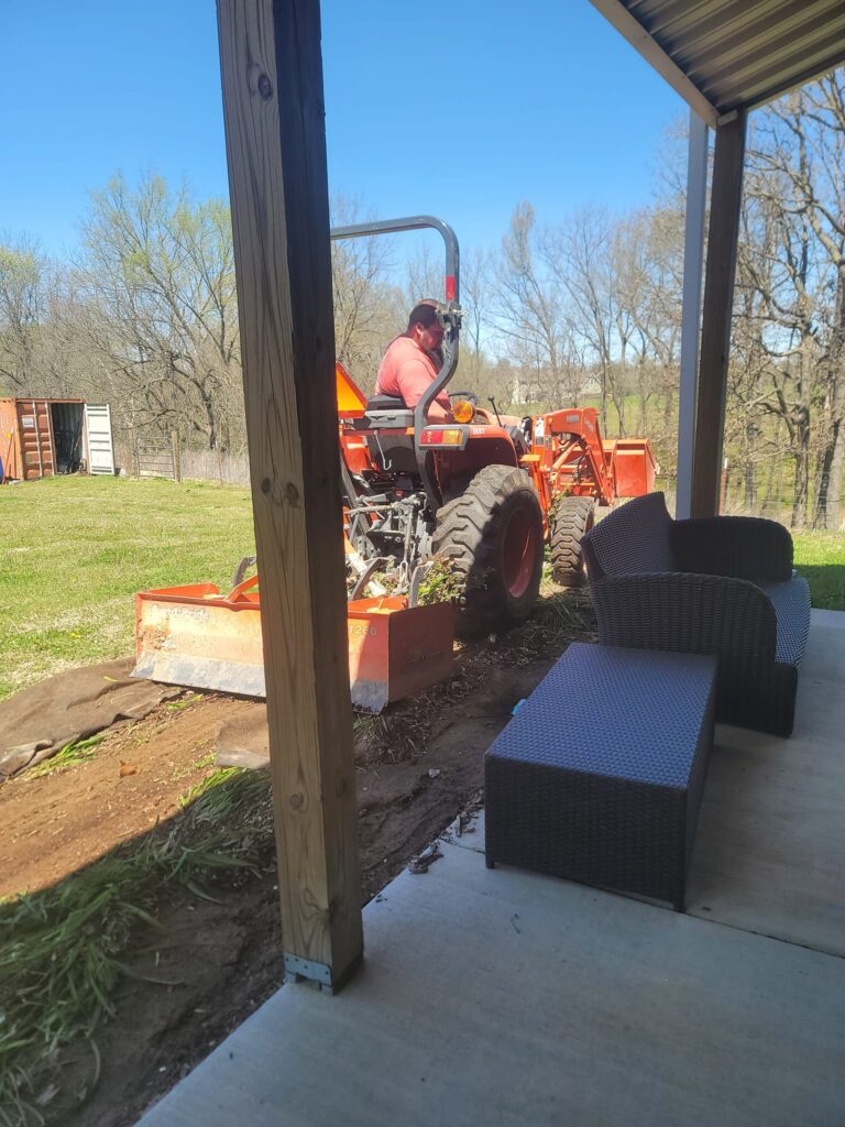 Preparing the soil for a flower bed installation.