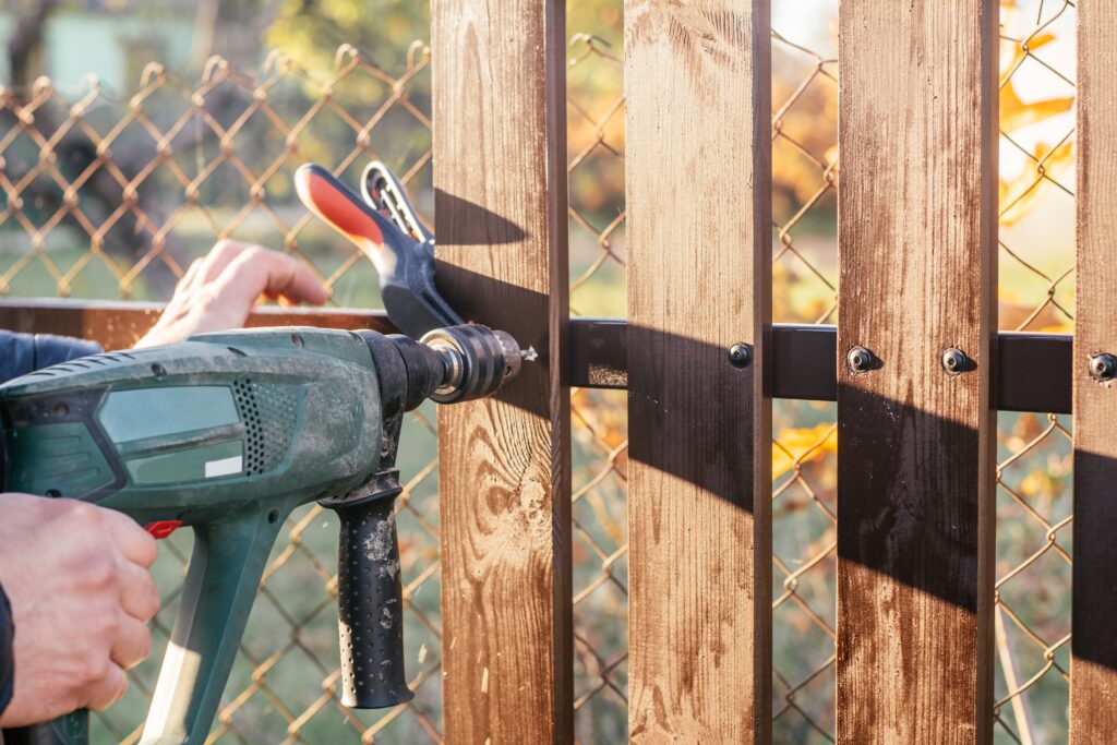 Handy Dan performing fence repairs.